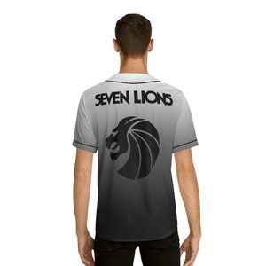May include: A white baseball jersey with a black ombre fade. The jersey has a black lion head logo and the text "SEVEN LIONS" printed on the back.