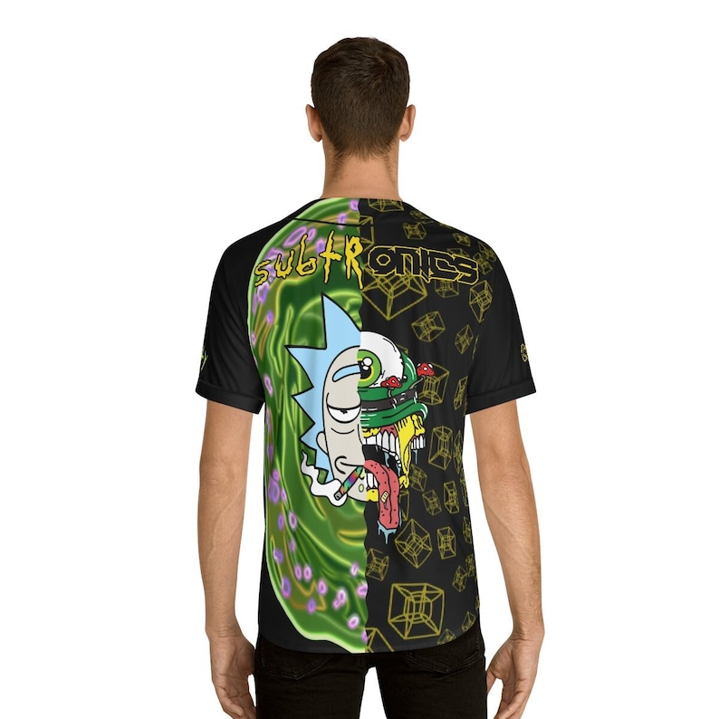 May include: Black t-shirt with a green and black graphic print of a cartoon character with the text "Subtronics" on the front.