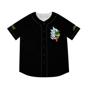 May include: Black baseball jersey with a graphic print of a cartoon character with a green and blue head and the text "Schy" and "Stay" on the sleeves.