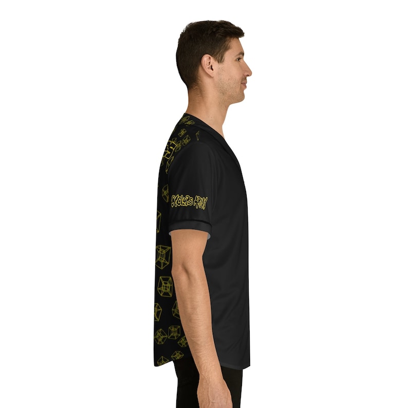 May include: Black baseball jersey with a yellow geometric pattern and the text "Cycles Are Fun" on the sleeve.