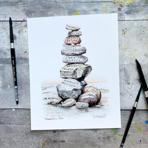 May include: Watercolor painting of a stack of stones with inspirational words like "Kindness," "Desire," and "Prayer." The artwork includes the text "Remembrance Stones" and the artist's signature. Paintbrushes are visible.