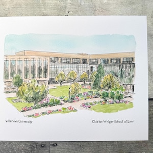 May include: Watercolor painting of the Charles Widger School of Law at Villanova University. The artwork depicts a modern building with large windows, surrounded by green lawns, trees, and flower beds. The sky is a light blue.