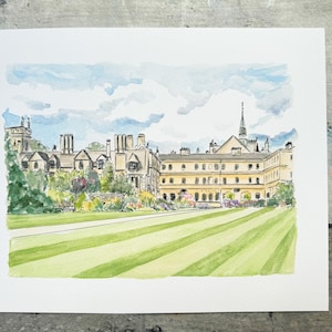 May include: Watercolor painting of a large building with multiple stories and a tall steeple. The building is light yellow with dark brown roofs and windows. A green lawn with stripes is in the foreground, and a blue sky with clouds is in the background.