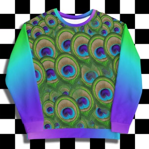 May include: A colorful sweatshirt with a gradient design in shades of blue, green, and purple. The front of the sweatshirt features a pattern of peacock feathers.