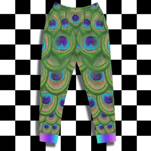 May include: Green sweatpants with a peacock feather pattern. The sweatpants have a blue and purple iridescent trim at the bottom.