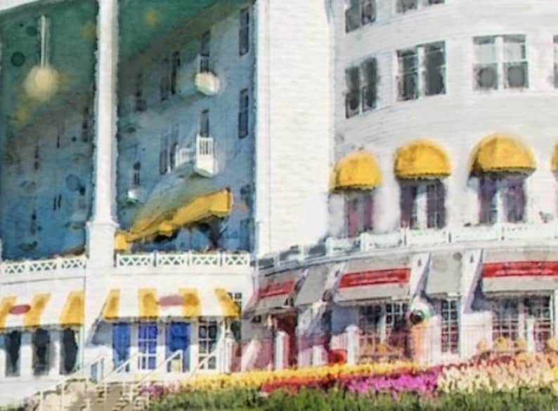 May include: A watercolor painting of a large white building with yellow awnings and a yellow striped awning over a storefront. The building has many windows and a balcony. The building is surrounded by flowers.