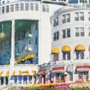 May include: A white building with yellow awnings and a large porch. The building has many windows and a balcony. The building is surrounded by flowers.