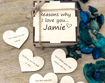 May include: Wooden box with a heart-shaped lid that says "Reasons why I love you... Jamie" on the front. The box contains small wooden hearts with different reasons written on them.