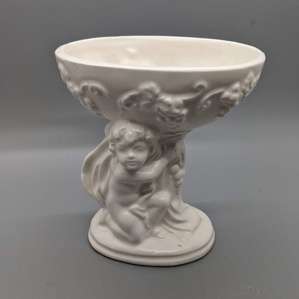 Inarco White Ceramic Pedestal Planter or Vase with Kneeling Cherub and Grape Clusters Item Number E-3453