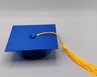 Adorno para pastel con forma de birrete de graduación y borla incluida.