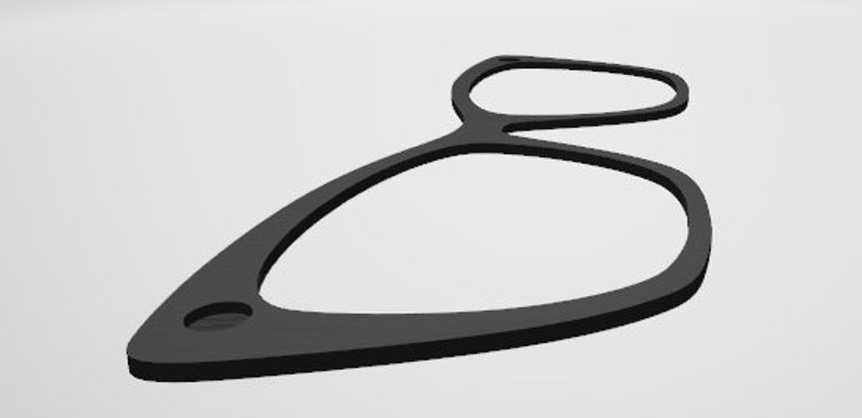 Pu&ograve; includere: Un anello di plastica nero con un foro al centro. L'anello ha la forma di un otto.