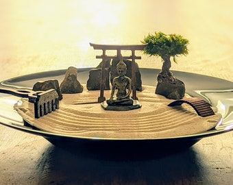 Zen garden for meditation, relaxation & mindfulness training with torii, bridge, wooden rake, Buddha and moss trees - sustainable