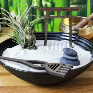 Zen garden in an opal glass bowl with a Buddha figure, tillandsie, rake & torii in Feng Shui style, sustainable gift idea