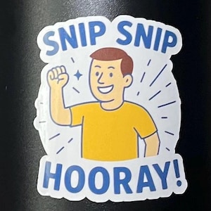 May include: A sticker with a cartoon illustration of a person in a yellow shirt raising a fist. The sticker has the words "SNIP SNIP" above the illustration and "HOORAY!" below, all in blue text.