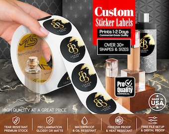 May include: A roll of circular custom sticker labels featuring a black background with a gold brushstroke and the logo text Luxury Design. The labels are displayed alongside cosmetic bottles and include text such as Custom Sticker Labels, Pro Quality, and Made in USA.