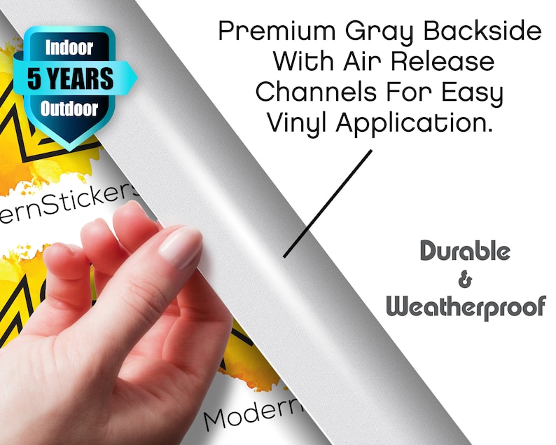 May include: A close-up of a hand peeling back a gray vinyl sticker. The sticker has the text "Premium Gray Backside With Air Release Channels For Easy Vinyl Application." and "Durable & Weatherproof" printed on it. The sticker also has a label that says "Indoor 5 YEARS Outdoor".