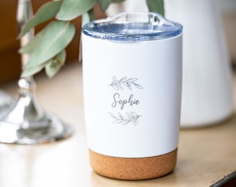 Small white or matte black thermal mug, with personalized name and leafy branches laser engraved on it.