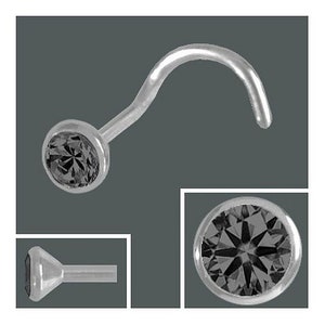 K&ouml;nnte beinhalten: Ein silberner Nasenring mit einem schwarzen Edelstein. Der Ring ist gebogen und hat einen kleinen, runden Edelstein.