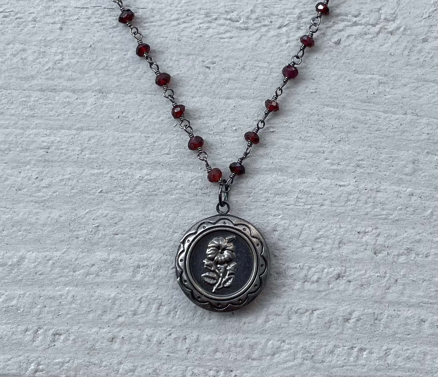 Gunmetal garnet locket necklace