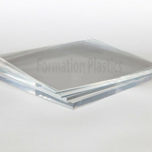 May include: A stack of clear acrylic sheets, with the text "Formation Plastics" printed on the top sheet.