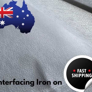 May include: White interfacing fabric with a textured surface. The fabric is rolled up and the text "Interfacing Iron on" is visible in the bottom left corner. A black circle with the text "FAST SHIPPING" is visible in the bottom right corner.