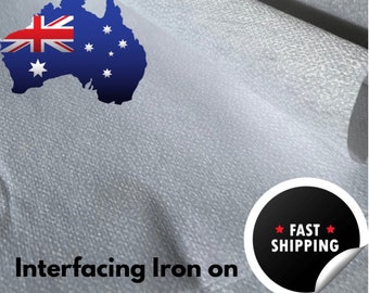 May include: White interfacing fabric with a textured surface. The fabric is rolled up and the text "Interfacing Iron on" is visible in the bottom left corner. A black circle with the text "FAST SHIPPING" is visible in the bottom right corner.