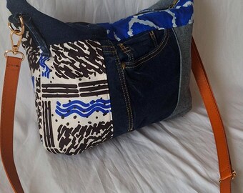 Shoulder bag made from recycled blue wax print denim with ethnic patterns, zipper closure