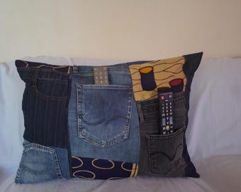 Cushion cover made from recycled denim fabric with zipper, added colored wax.