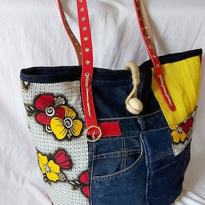 Tote bag made from recycled jeans, floral wax, yellow and red jute, belt handles and hand-woven cord