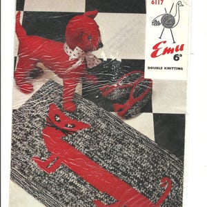 May include: A vintage knitting pattern booklet featuring a red knitted cat toy and a black and white knitted rug with a red cat design. The booklet cover features the text "Emu 6d Double Knitting" and a drawing of an emu with yarn.