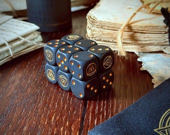 Dados D6 Ojo del Cuervo - Negro Mate - Paquete de 12 - para Warhammer y juegos de rol de mesa