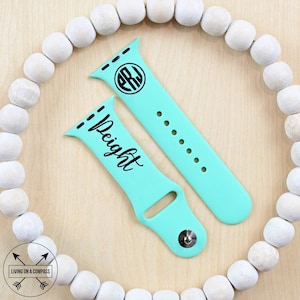 May include: Two turquoise silicone Apple Watch bands with black text. One band has the monogram "PRJ" and the other band says "Deight".