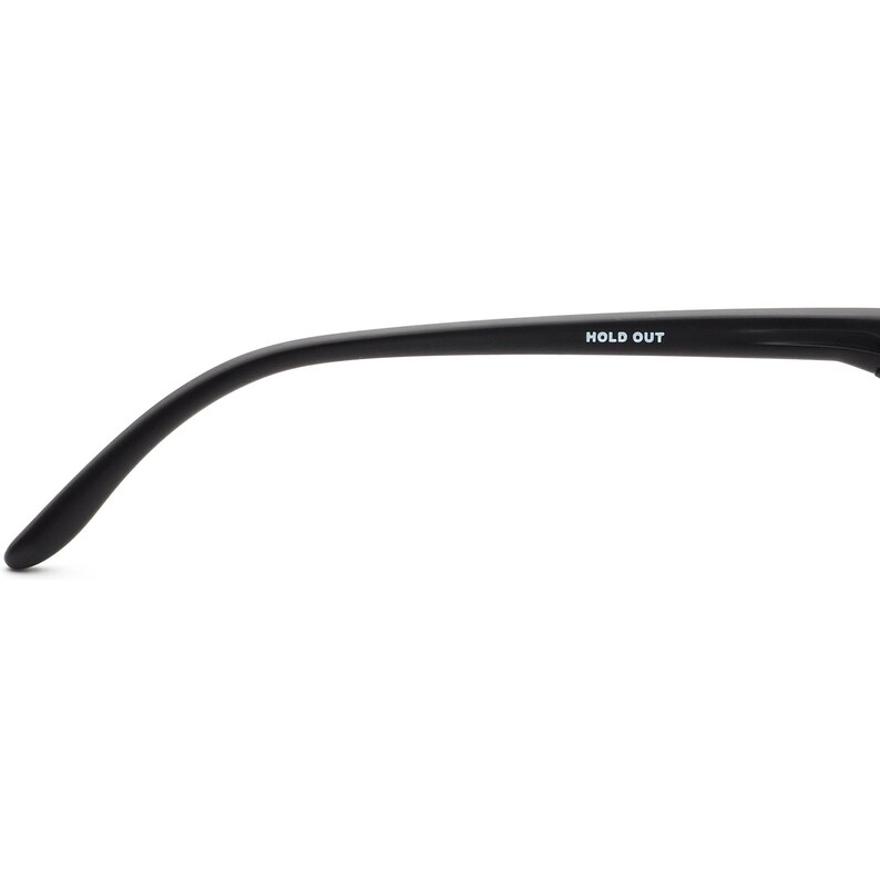 May include: Black eyeglasses arm with the text "HOLD OUT" in white. The arm curves gently, with a rounded tip. The background is plain white.