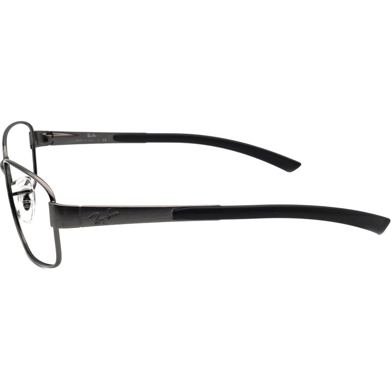 May include: Dark grey metal eyeglasses with black temples. The glasses have a rectangular frame and the Ray-Ban logo is visible on the temple. The lenses are clear.
