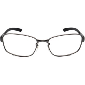 May include: Rectangular spectacles with a dark grey metal frame and black temples. The lenses are clear, and the nose bridge is thin. The spectacles have a modern, minimalist design.
