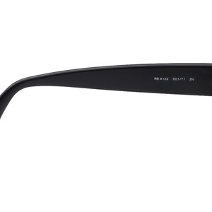 May include: Black rectangular frame sunglasses with the text "RB 4122 601/71 3N" printed on the side.