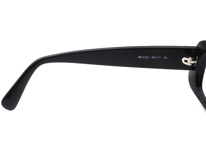 May include: Black rectangular frame sunglasses with the text "RB 4122 601/71 3N" printed on the side.