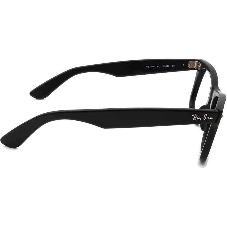 May include: Black Ray-Ban spectacles with a classic rectangular frame and black arms. The arms are marked with the Ray-Ban logo and model number.