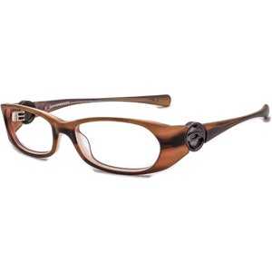 May include: Brown tortoise shell eyeglasses with a clear lens and a small logo on the side.