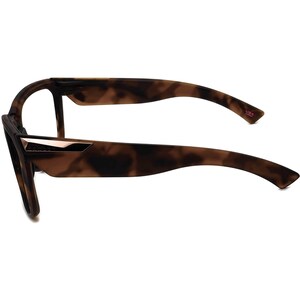 May include: Tortoise shell eyeglasses with a rose gold accent on the front and a "USA" inscription on the right arm.