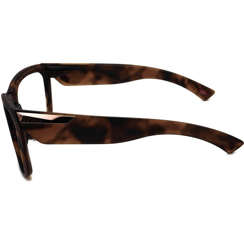 May include: Tortoise shell eyeglasses with a rose gold accent on the front and a "USA" inscription on the right arm.