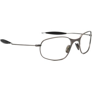 May include: A pair of rimless eyeglasses with a dark gray metal frame. The lenses are clear, and the temples have black rubberized ear pieces. The nose pads are also a light gray color.