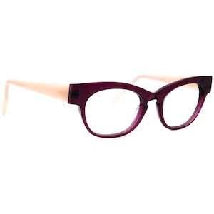 May include: A pair of cat-eye eyeglasses with a deep purple frame and light peach-colored arms. The glasses have a classic, retro design, suitable for everyday wear. The lenses are clear.
