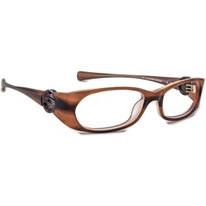 May include: Brown tortoise shell eyeglasses with a clear lens and a small logo on the side. The glasses have a thin metal frame and a spring hinge.
