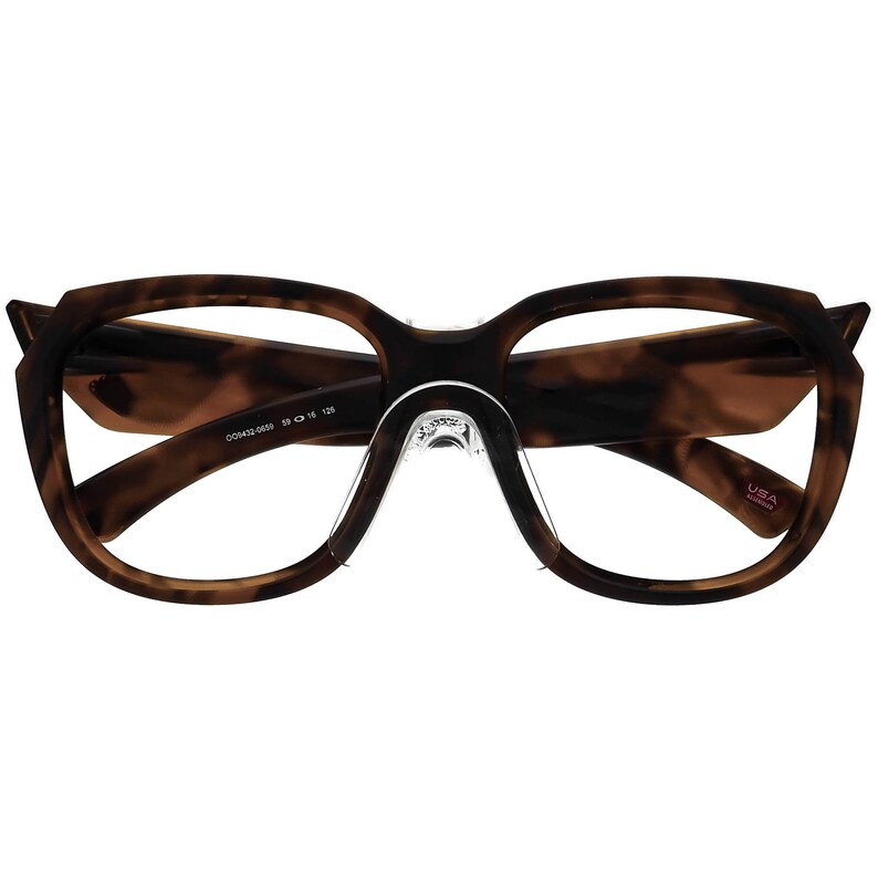 May include: Tortoise shell eyeglasses with a clear plastic nose bridge and a black inscription on the side that reads "00H42 0056 50 16 128". The inscription "USA assembled" is visible on the right temple.