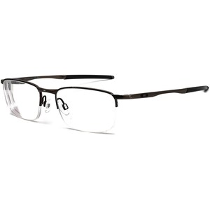 May include: A pair of brown metal frame eyeglasses with clear lenses. The glasses have a thin metal frame and a slightly squared shape.