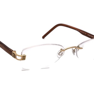Daniel Swarovski Eyeglasses S124 20 6054 23KT GP Gold/Brown Rimless 50[]20 125