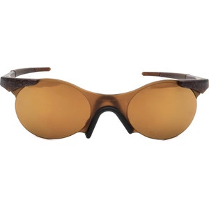 May include: Brown wraparound sunglasses with a mirrored lens.