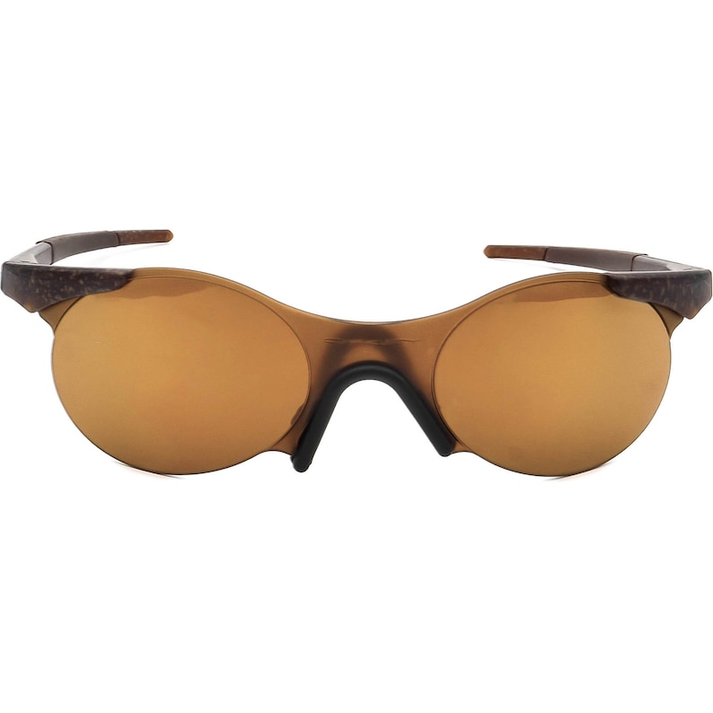 May include: Brown wraparound sunglasses with a mirrored lens.