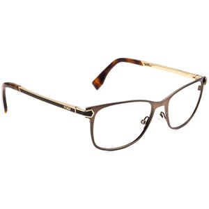 May include: Brown metal eyeglasses with gold accents and the word "FENDI" on the side.